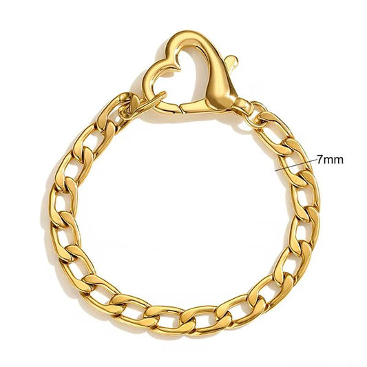 Gold chain bracelet with a heart clasp on a white background