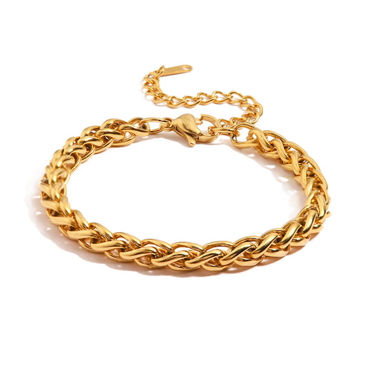 Braided chain bracelet flat lay on neutral background