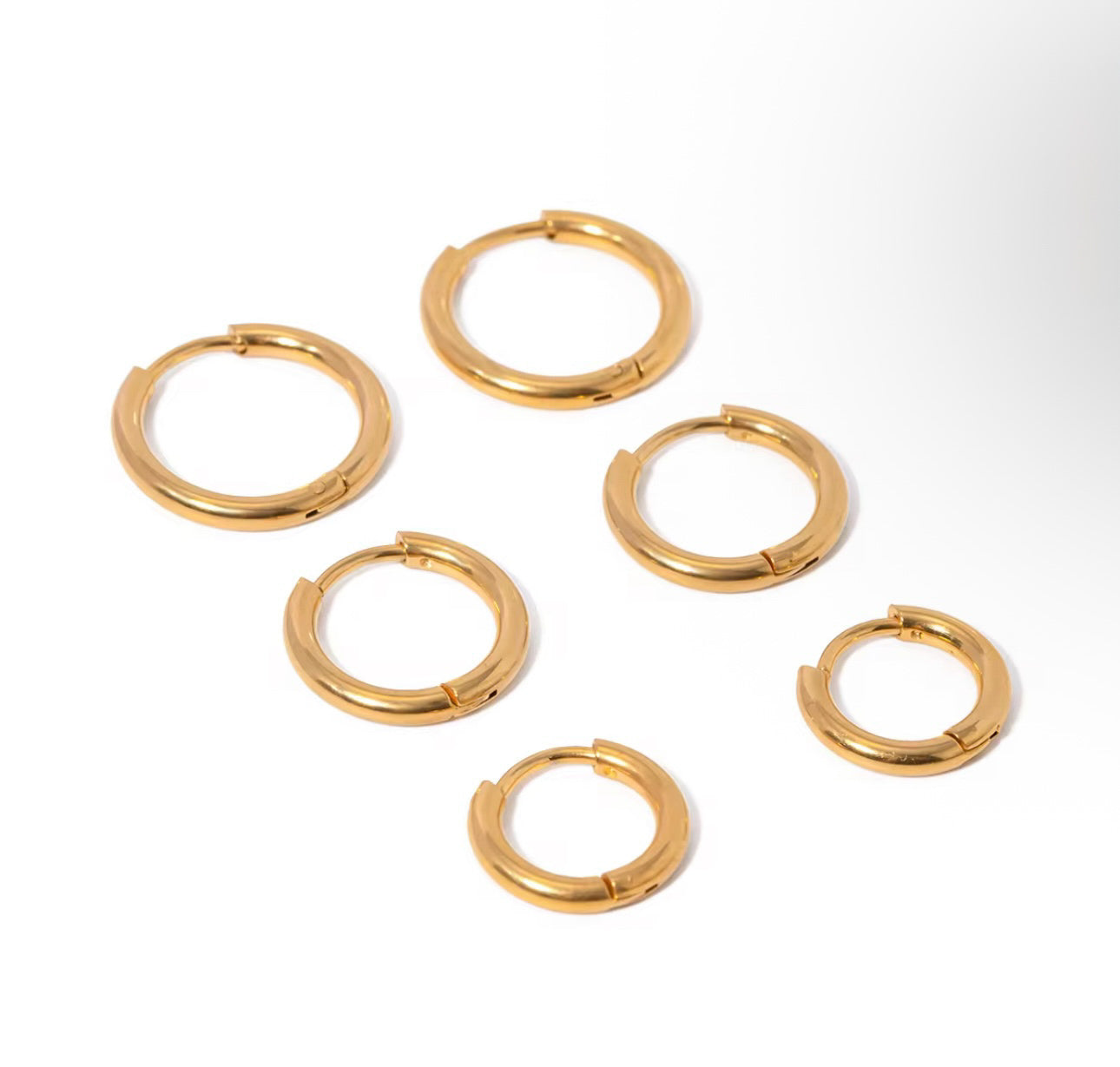 Set of gold hoop earrings stackable